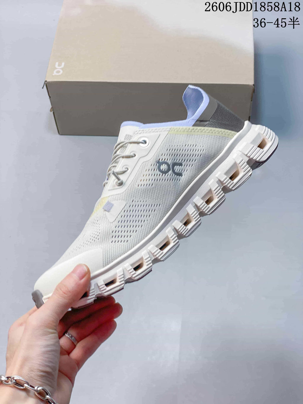 Side profile showing the perforated upper and segmented outsole