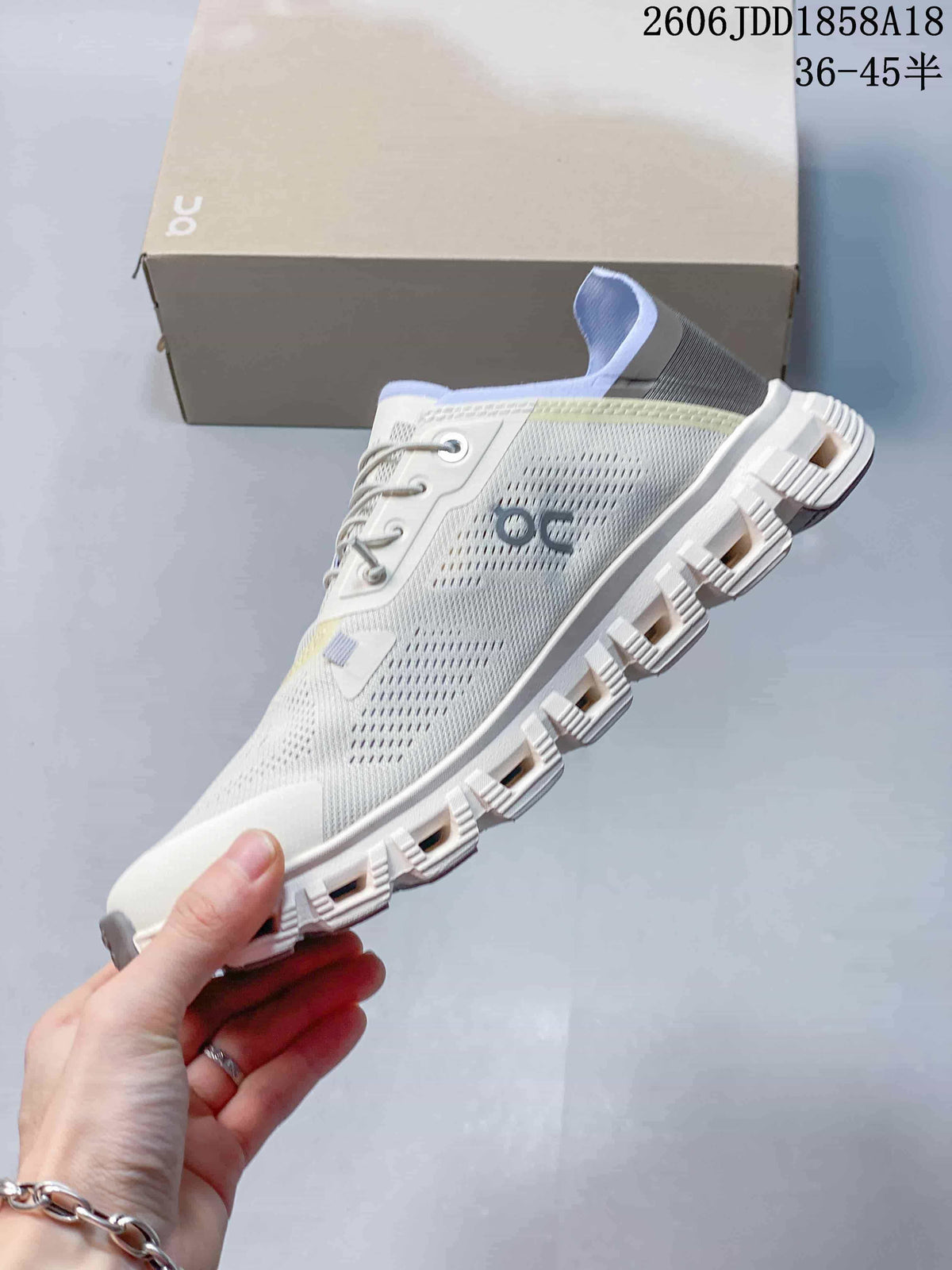 Side profile showing the perforated upper and segmented outsole