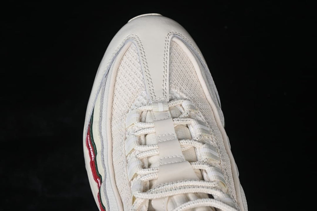 Top-down close-up of the sneaker toe and lace area.
