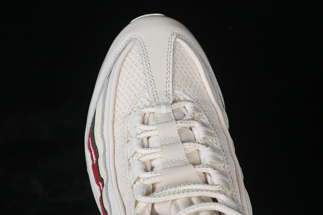 Top-down close-up of the sneaker toe and lace area.