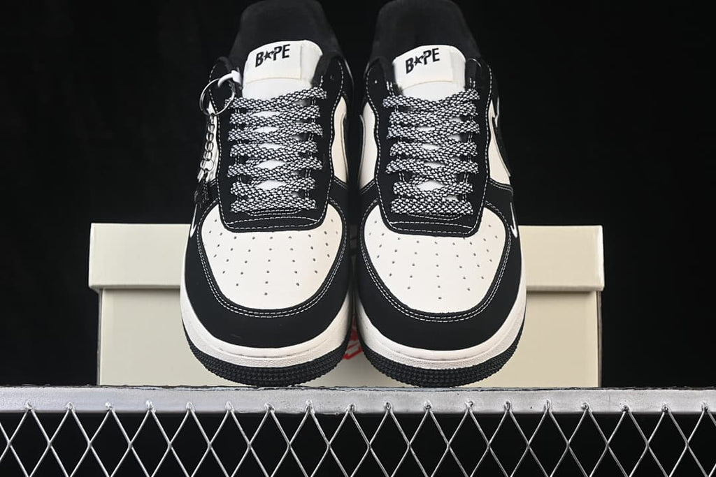 Front view of the pair, showing perforated toe panels and branded tongues.