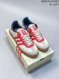 White and red adidas Originals Gazelle Indoor sneakers on horse-patterned packaging