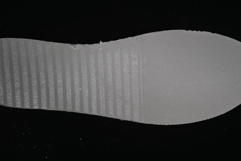 Close-up of the textured mauve outsole