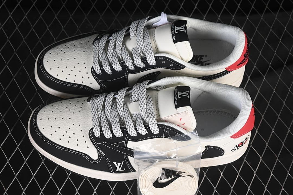 Top view of a pair of white and black low-top sneakers with patterned laces, red heel accents, and an extra lace set.