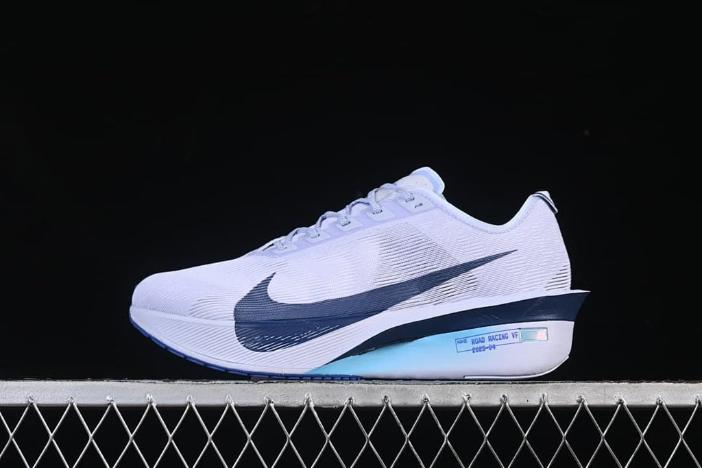 Side view of white and navy Nike ZoomX Vaporfly 4 road racing shoe