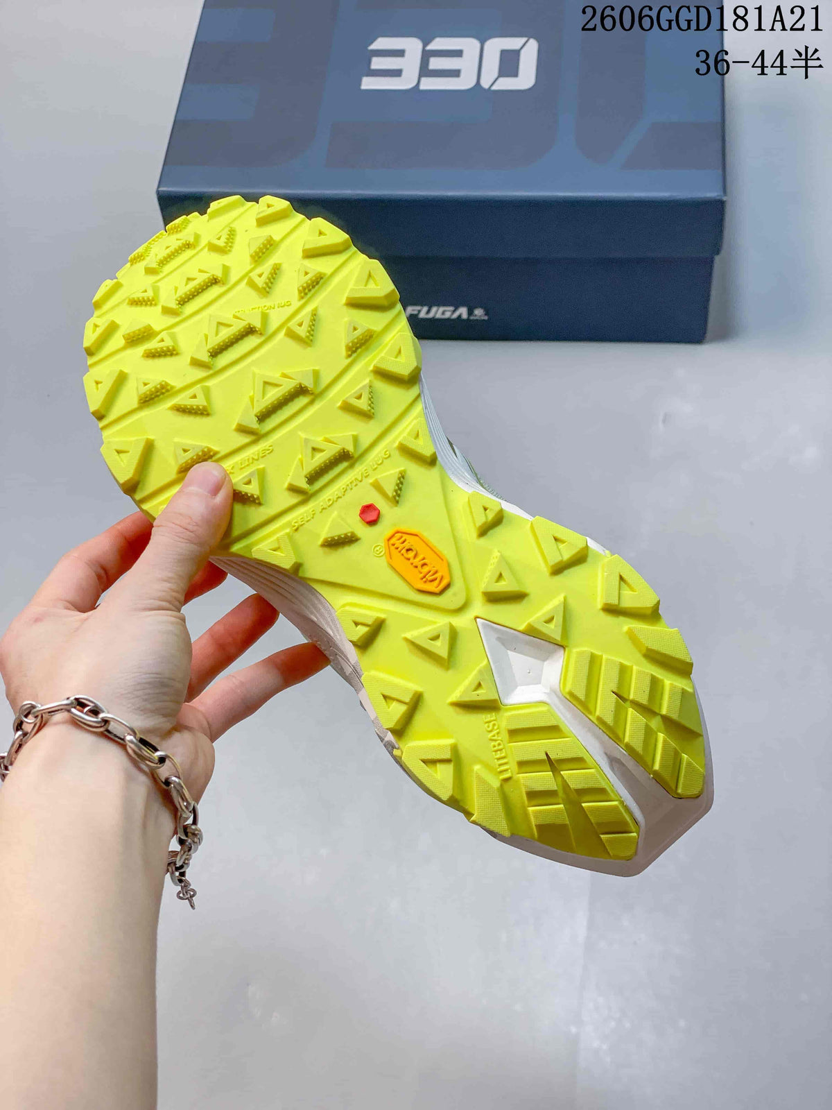 Close-up of the shoe's bright lime lugged outsole