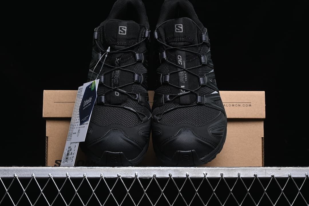 Front view of the pair of black trail running shoes