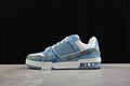 Side view of a blue and white Louis Vuitton Archlight sneaker with multicolor patterned panels.