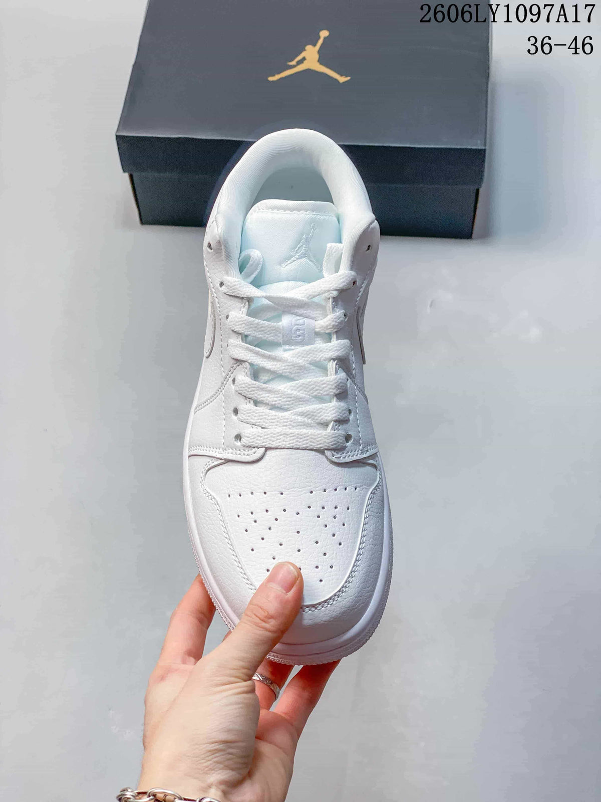 Top view of a white low-top sneaker with laces and a perforated toe