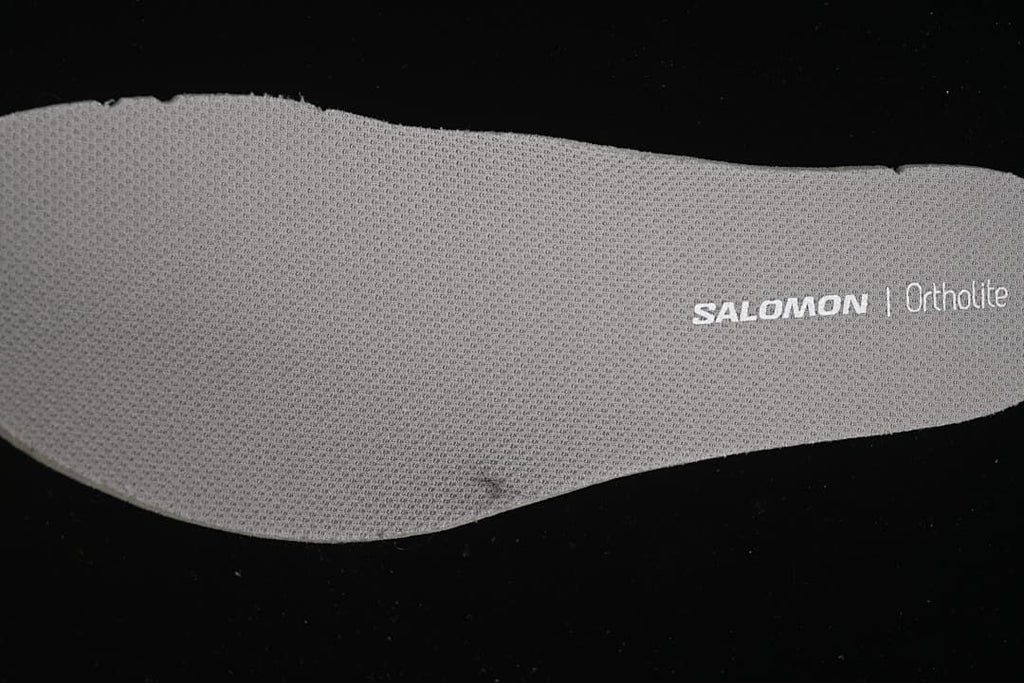 Close-up of a gray Salomon Ortholite-branded insole.