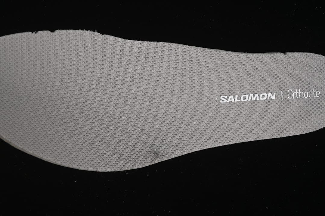 Close-up of a gray Salomon Ortholite-branded insole.