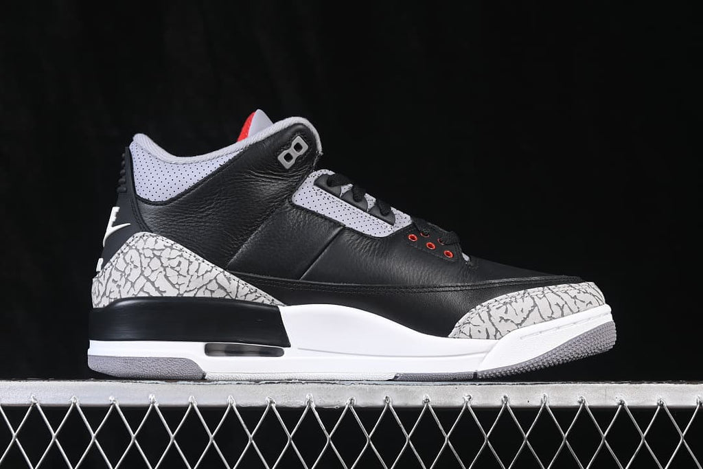 Side profile showing the black upper, elephant-print overlays and visible midsole Air unit