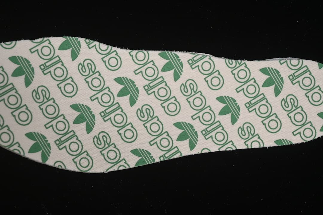 Close-up of an insole printed with adidas branding