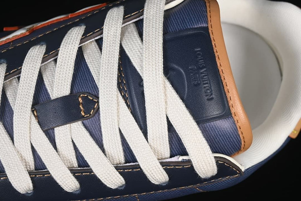 Close-up of the white laces and blue tongue