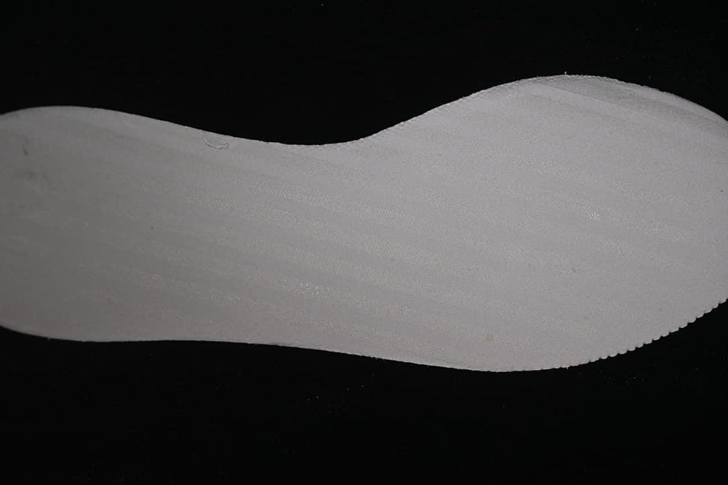 Close-up view of a light-colored shoe insert