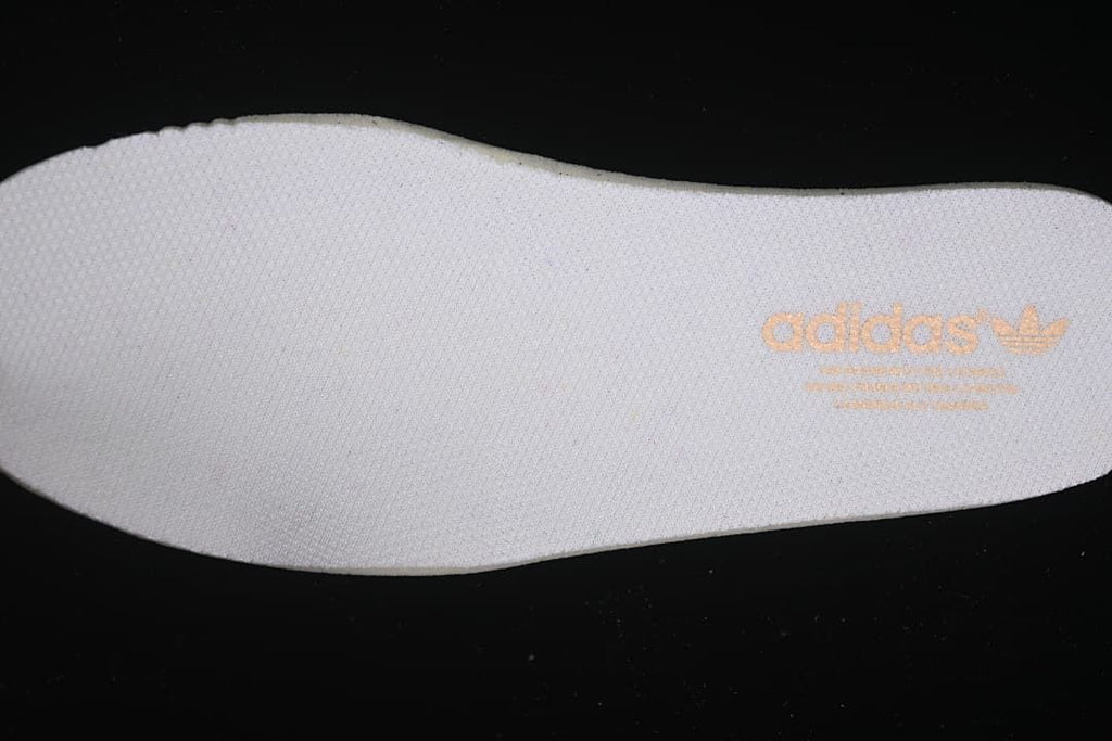 Close-up of the white insole with adidas branding.