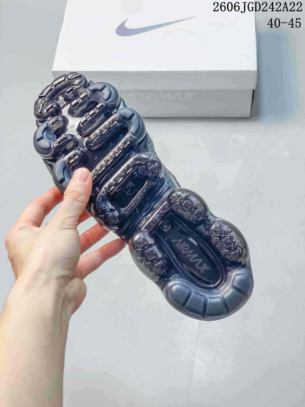 Underside view showing the translucent segmented sole of a Nike VaporMax sneaker