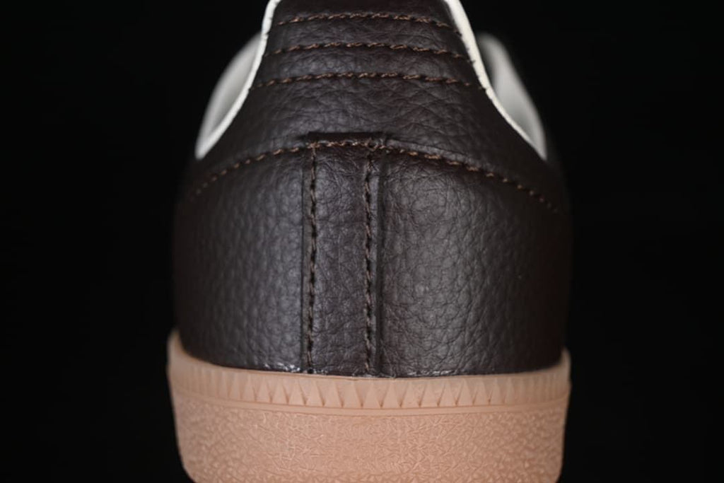 Close-up of the dark brown heel and gum-colored sole