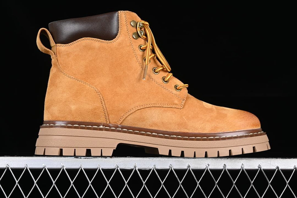 Side profile showing the boot upper, padded collar, and lugged sole