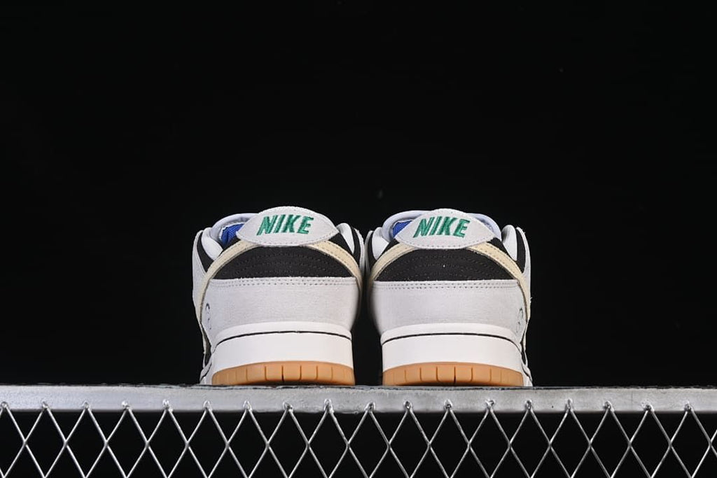 Rear view of the pair showing the heel labels and gum outsole.