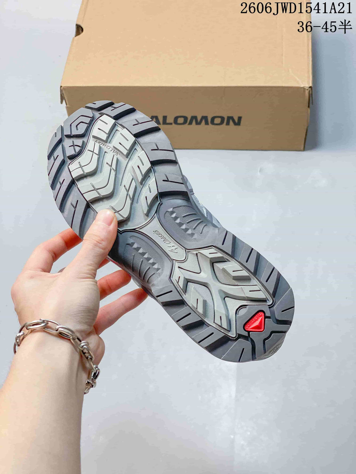 Close-up of the Salomon sneaker outsole with a lugged tread pattern.