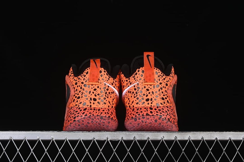 Rear view of the pair with heel pull loops and spotted pattern.
