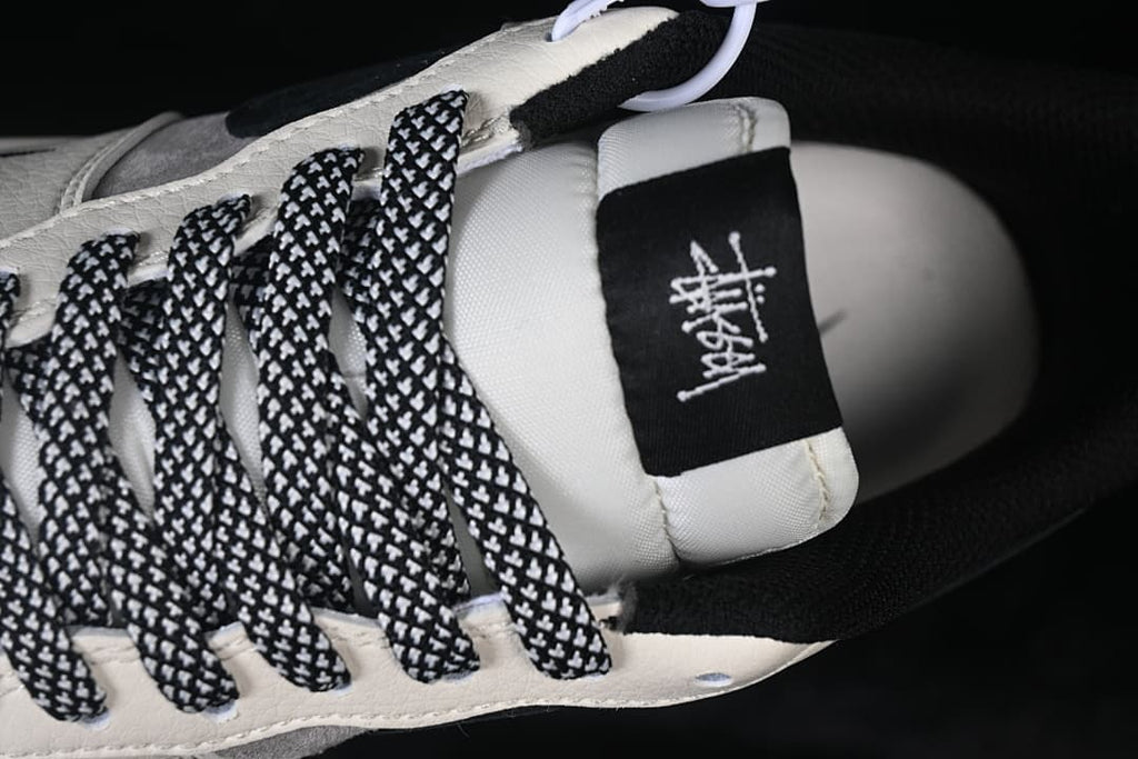 Close-up of the patterned laces and tongue label.