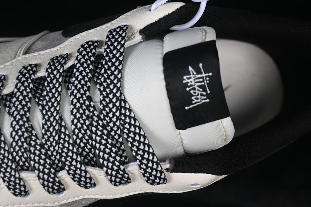 Close-up of the patterned laces and tongue label.