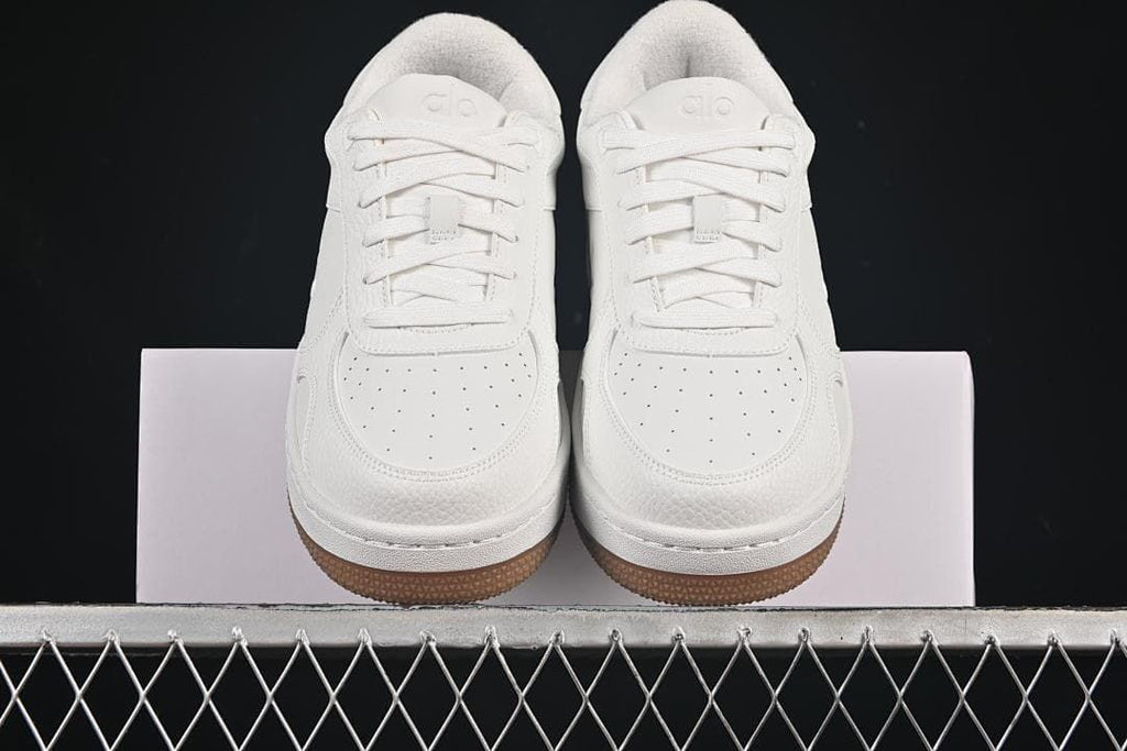 Front view of the pair showing perforated toes and gum outsoles
