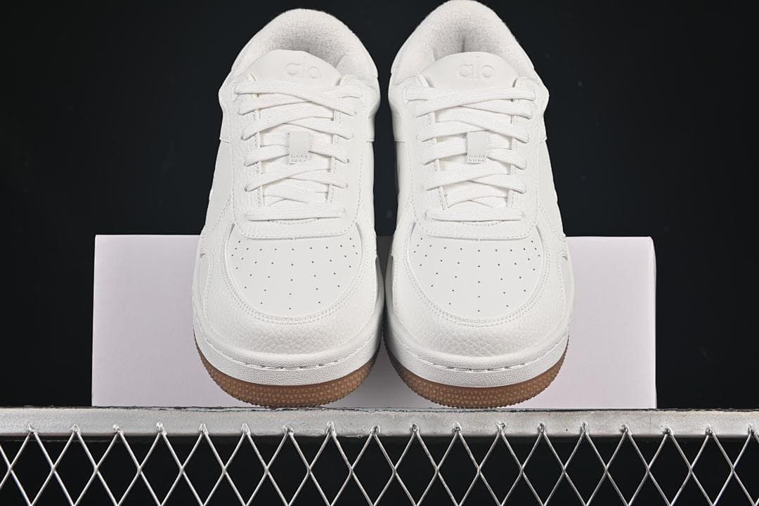 Front view of the pair showing perforated toes and gum outsoles