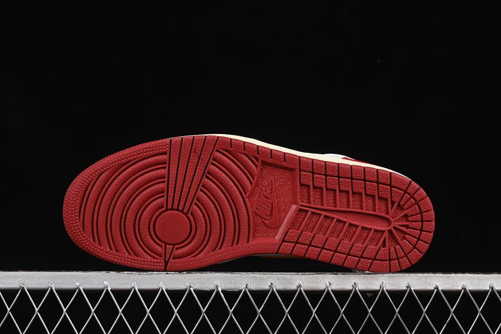 Underside view of the red outsole tread