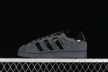 Side view of a charcoal gray adidas Campus 00s sneaker with black stripes and dark sole