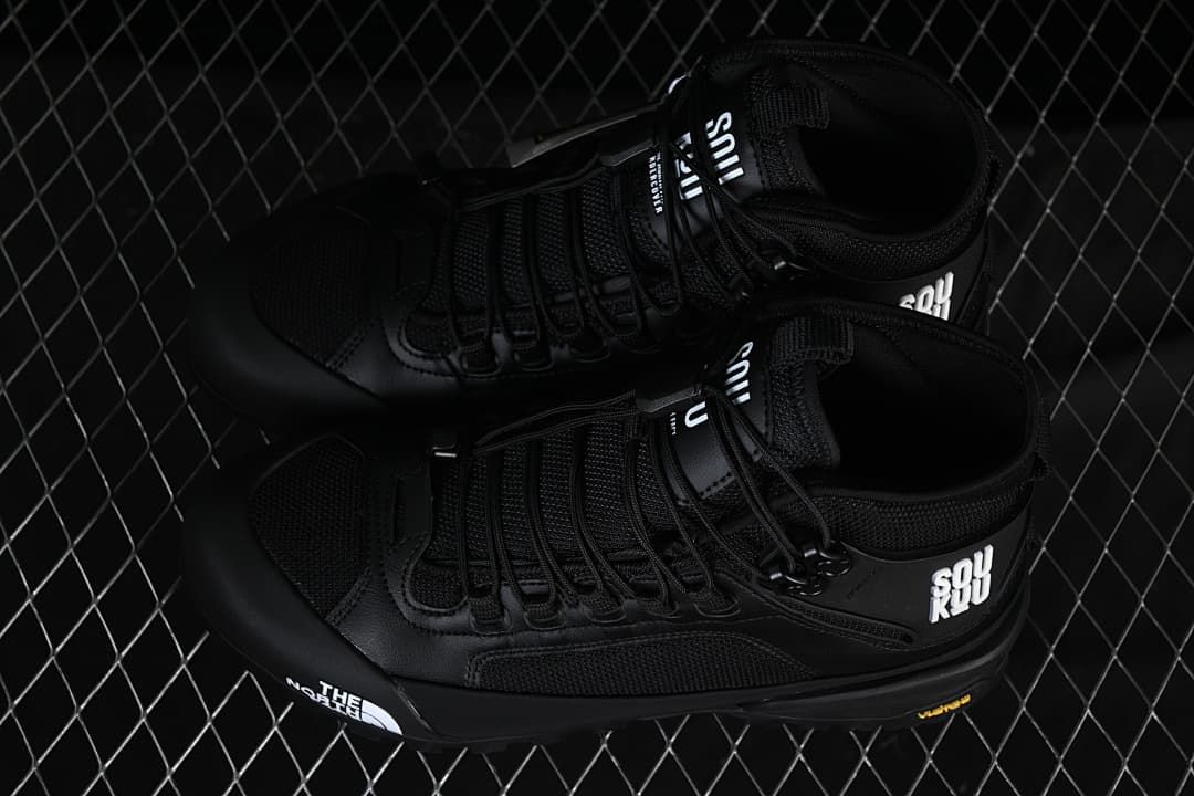 Pair of black mid-height hiking shoes viewed from above