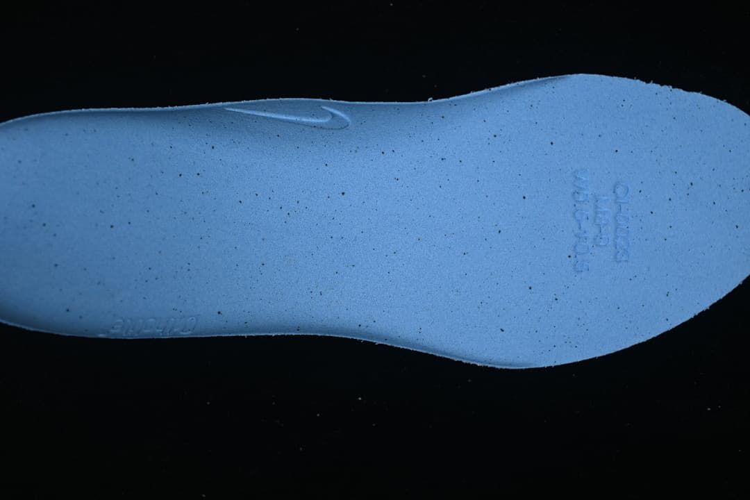Blue insole shown from the underside.