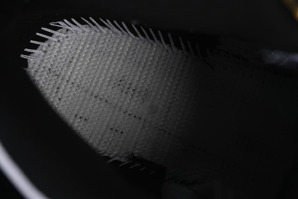 Close-up view inside the sneaker showing the lining and stitching.