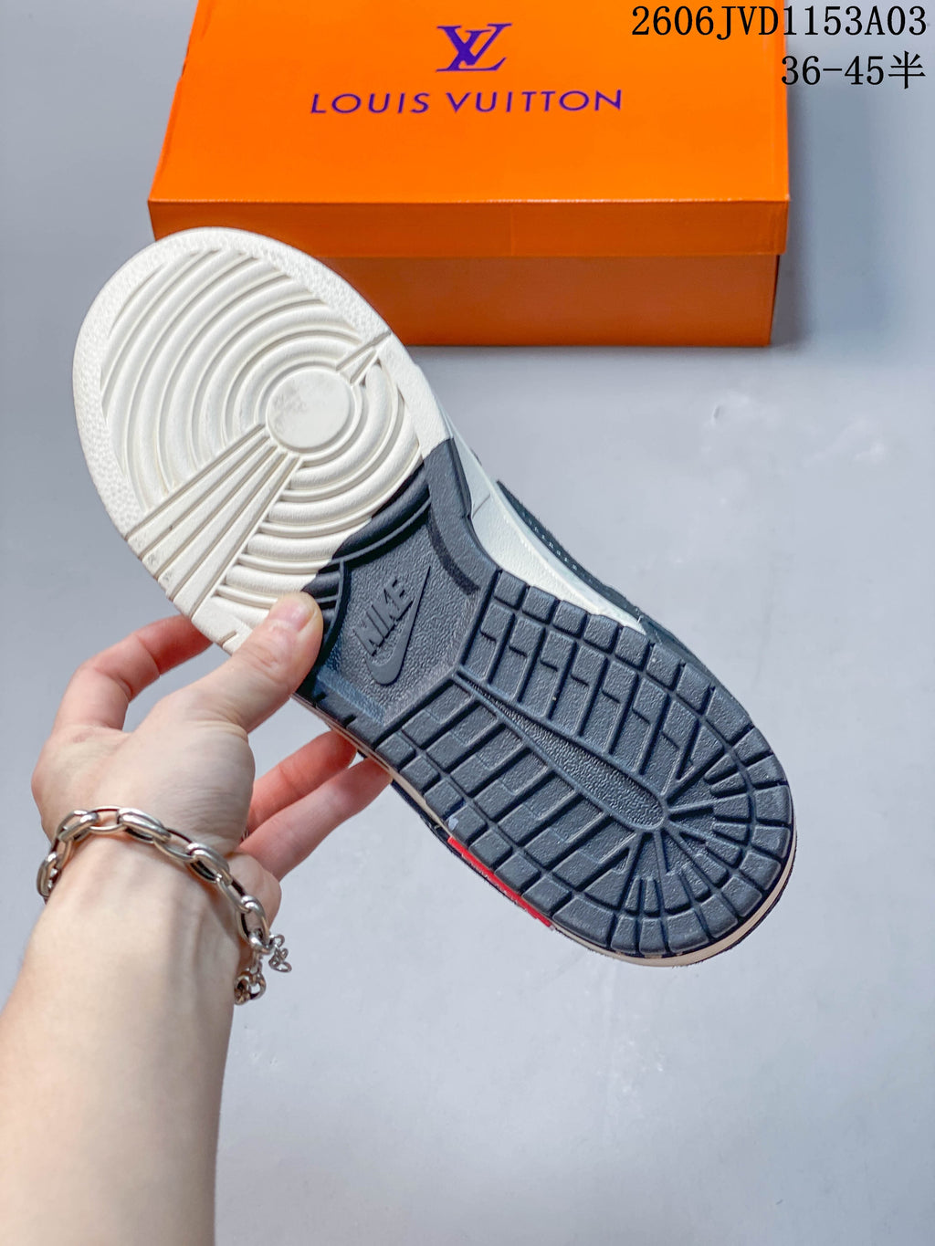 Textured outsole of a navy and off-white low-top sneaker