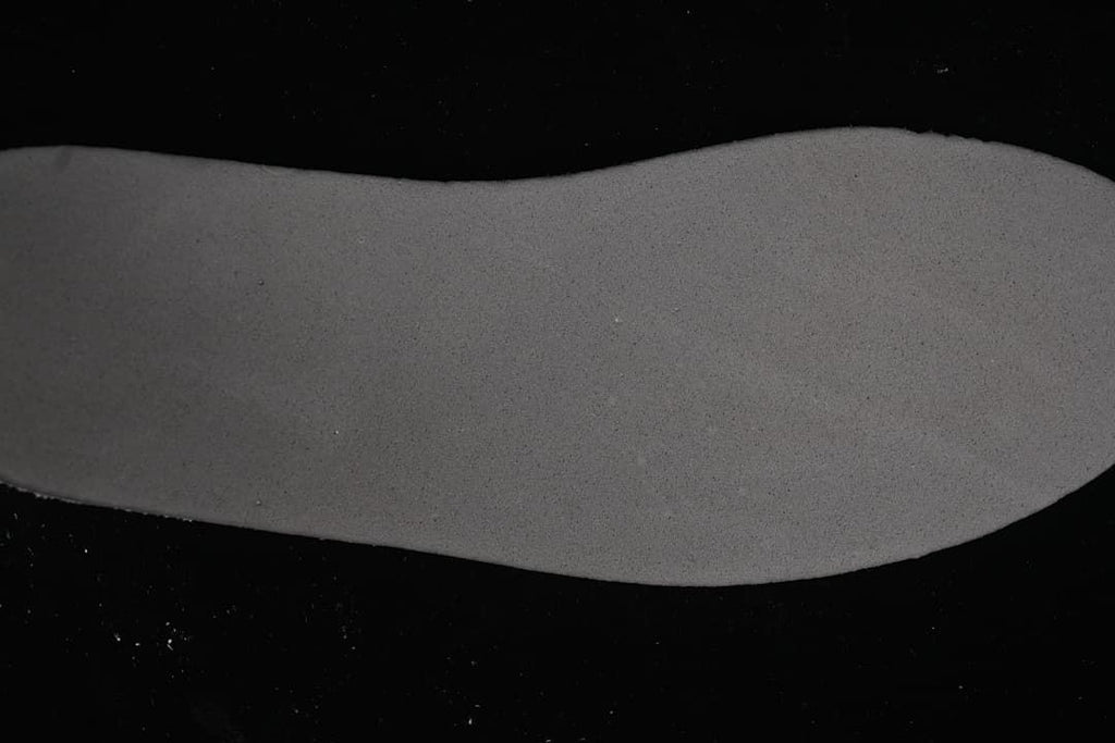 Close-up view of a grey shoe insole.