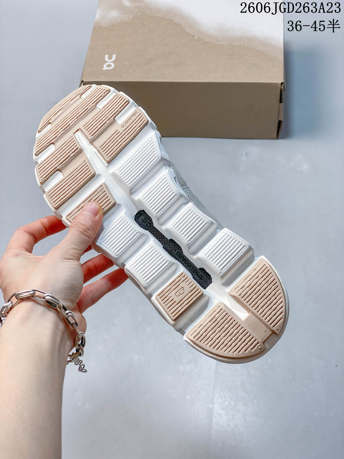 Underside of an On Cloudtilt Remix sneaker showing its segmented outsole