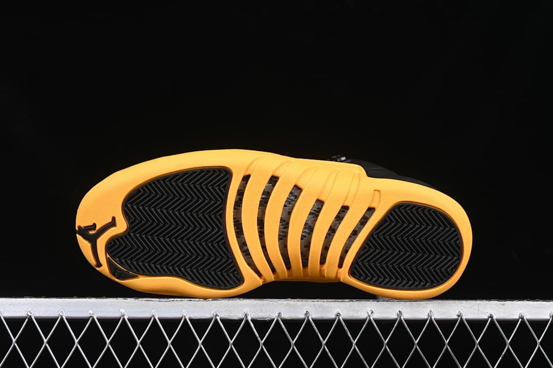 Underside view of the gold outsole with black traction sections