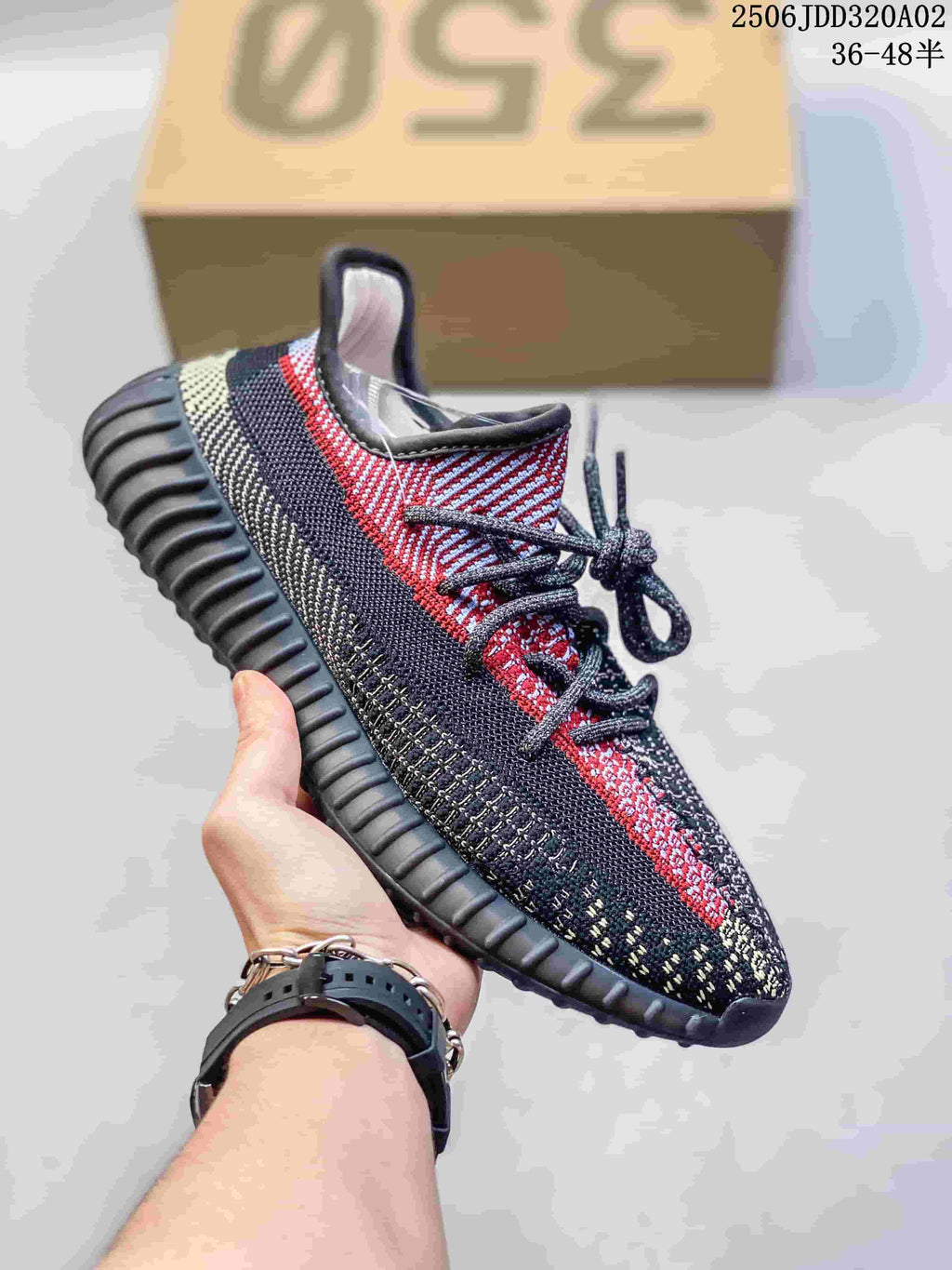 Dark knit low-top sneaker with red and gray side detailing