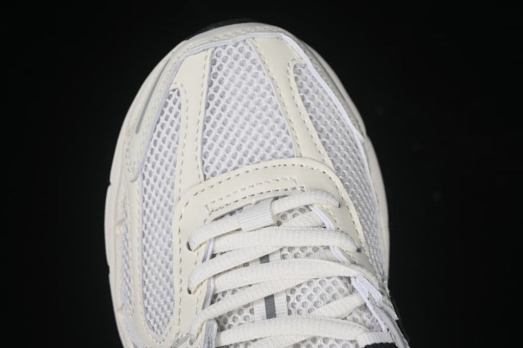 Top-down close-up of the mesh toe box and white laces.