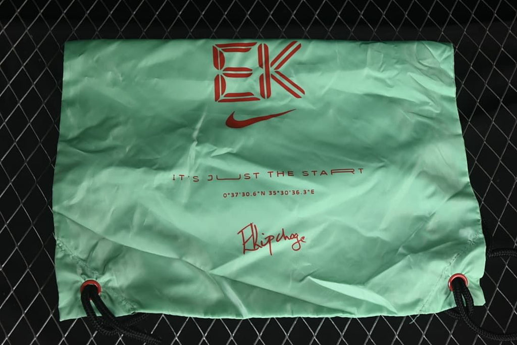 Mint-green drawstring bag with Nike and event-style graphics.