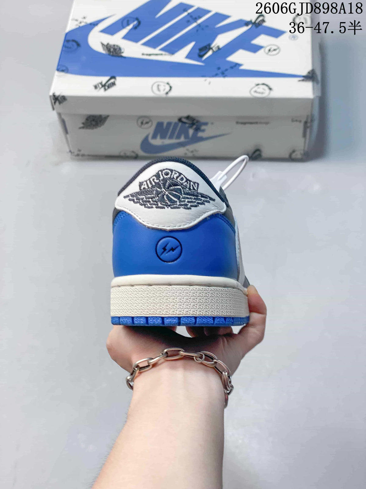 Rear view of a blue sneaker heel with a light-colored heel tab