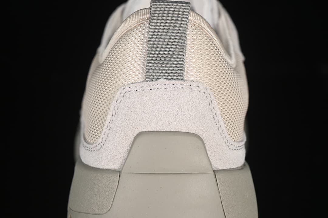 Rear view of the sneaker showing the heel pull tab and sole