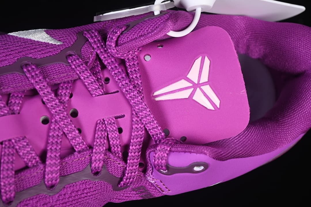 Close-up of the tongue badge and purple lace construction