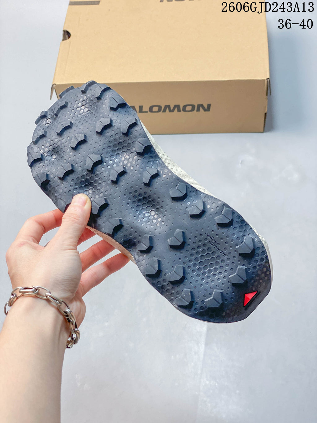 Close-up of the shoe's dark lugged outsole.