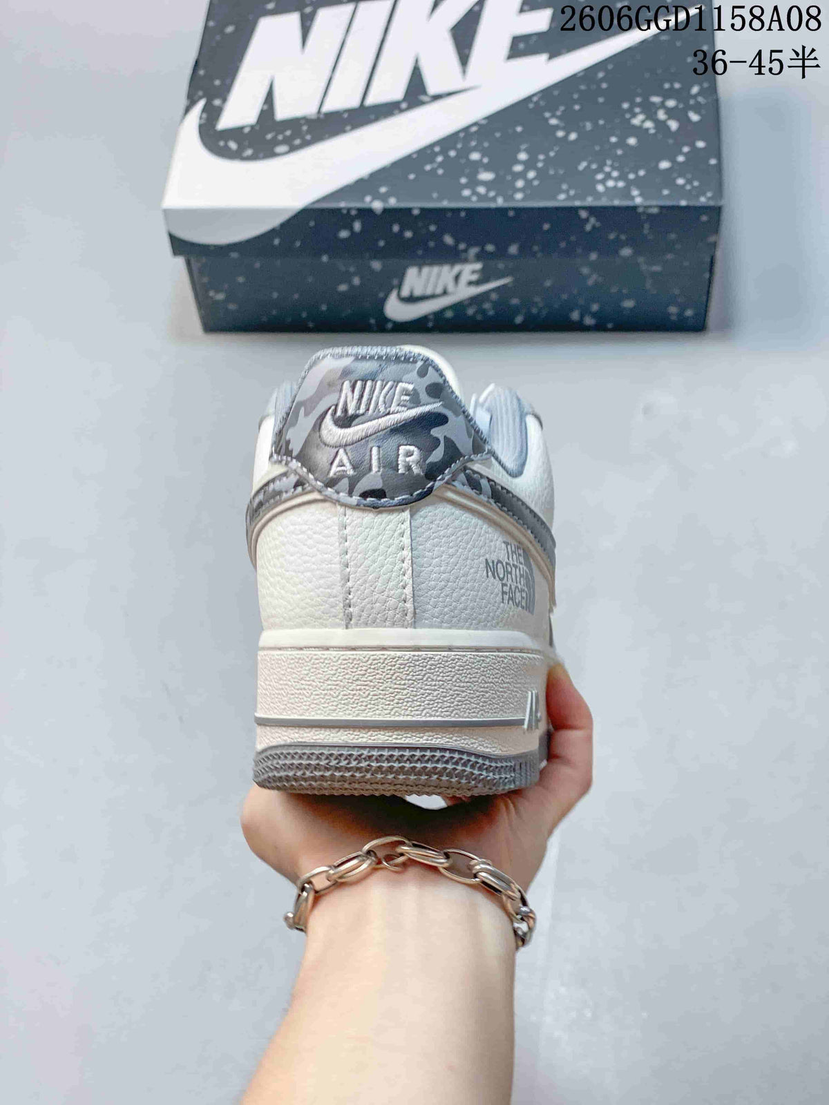 Rear view of the sneaker showing the heel and printed details
