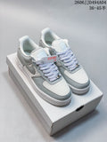 Pair of white and light gray Nike Air Force 1 '07 Low sneakers on a shoe box
