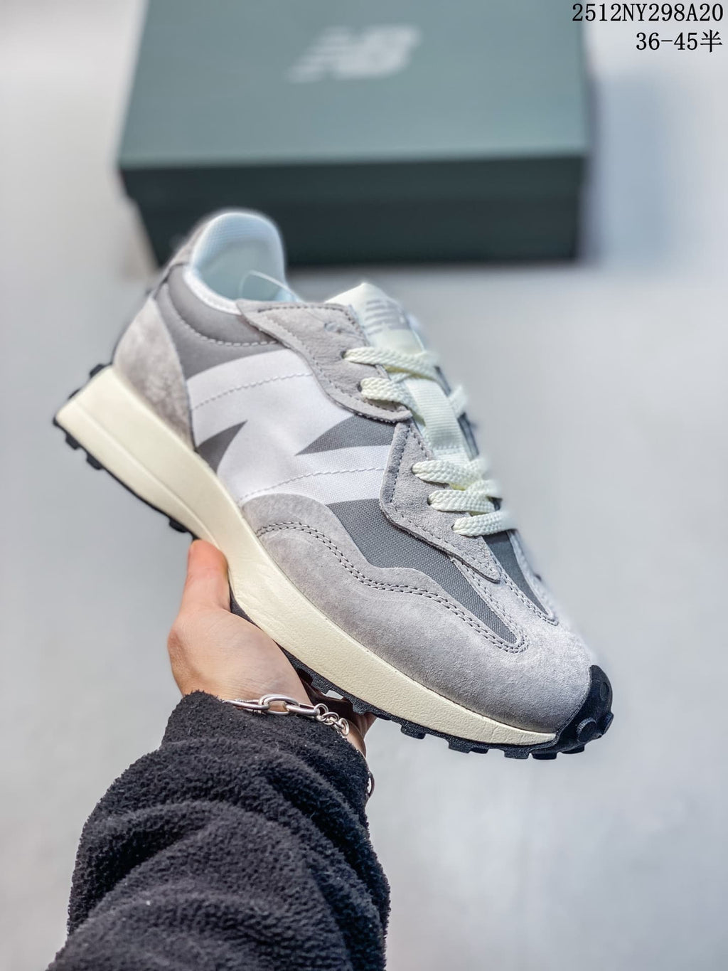 New Balance 327-style sneaker in gray and white with dark gray side detailing