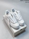 White Nike Air Force 1 ’07 Low sneakers with layered lace covers and zip details, photographed on a shoe box.